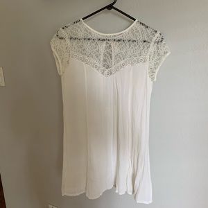 White lace mini dress with open back
